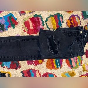 Black worn ripped jeans